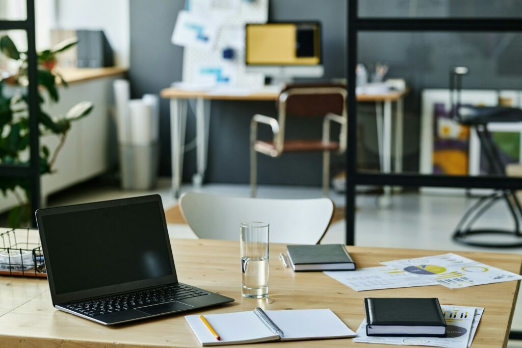 Workplace of economist or accountant with laptop and documents